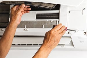 Ductless mini-split air conditioner installation.